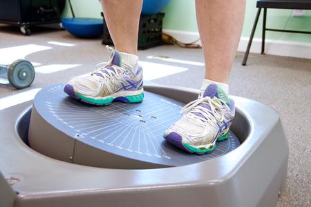 Close-up of a patient's feet on a Biodex balance training platform